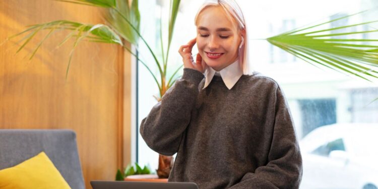 young woman studying library while using laptop 23 2149283330